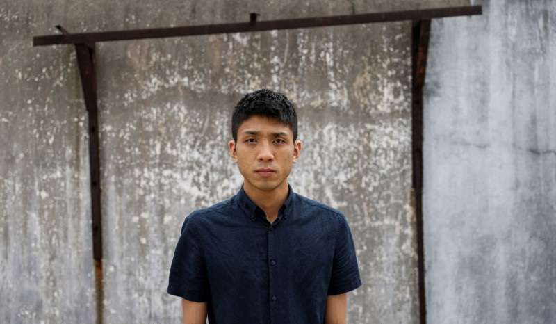 Pro-democracy activist Owen Chow poses for photo after an interview in Hong Kong