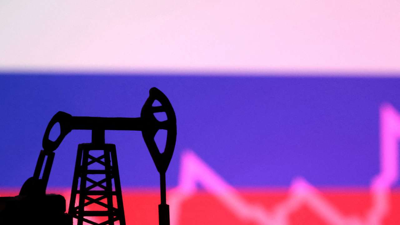 Illustration shows Russian flag, oil pump jack and stock graph