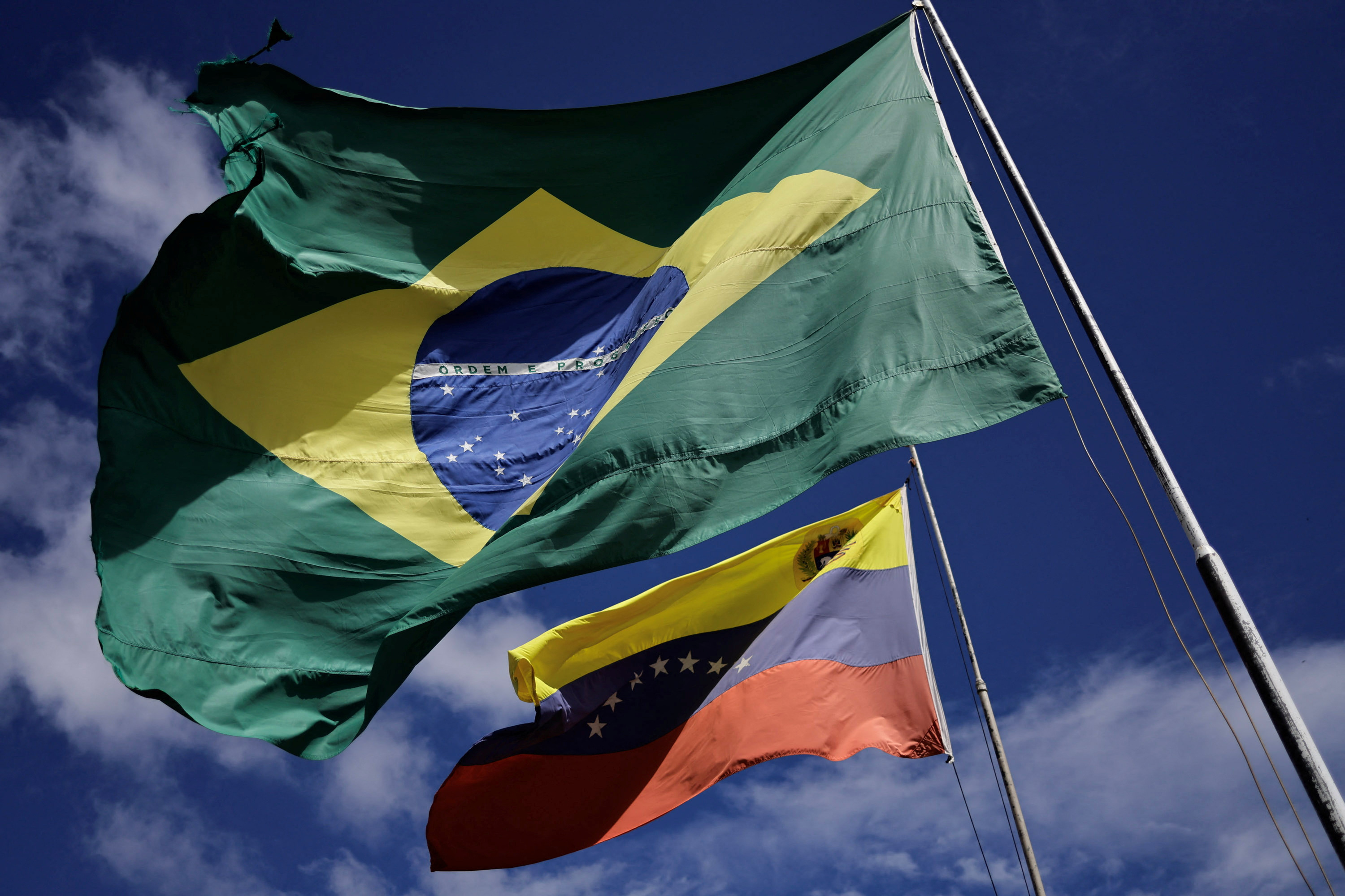 National flags of Brazil and Venezuela flutter at the Brazil-Venezuela border in the Brazilian city of Pacaraima