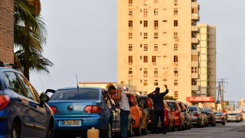 Drivers line-up to buy fuel at a gas station in Havana