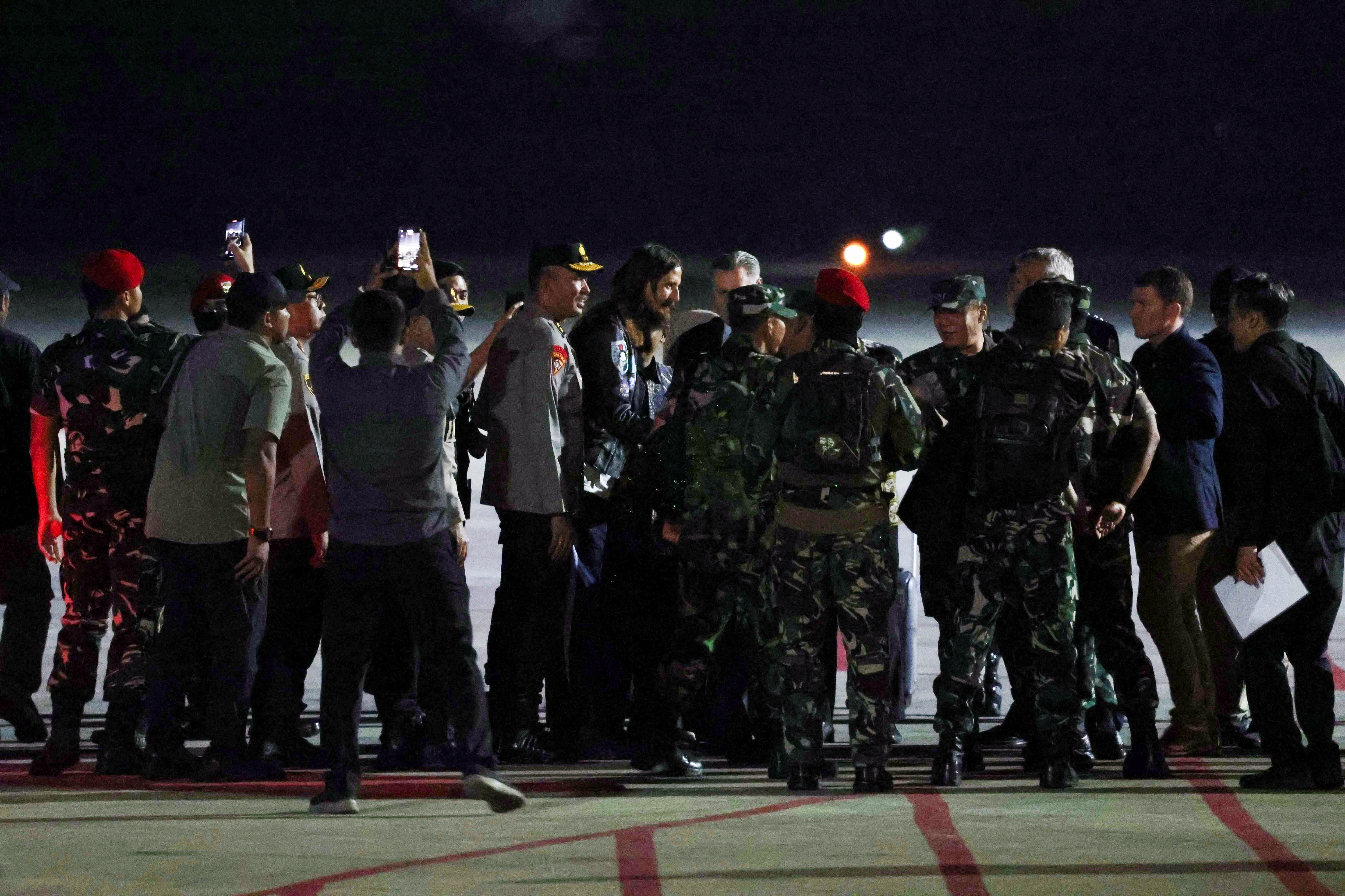 New Zealand pilot Phillip Mehrtens, who has been freed more than year and a half after being held hostage by a pro-independence group, arrives at Military Airbase Operation Halim Perdanakusuma in Jakarta
