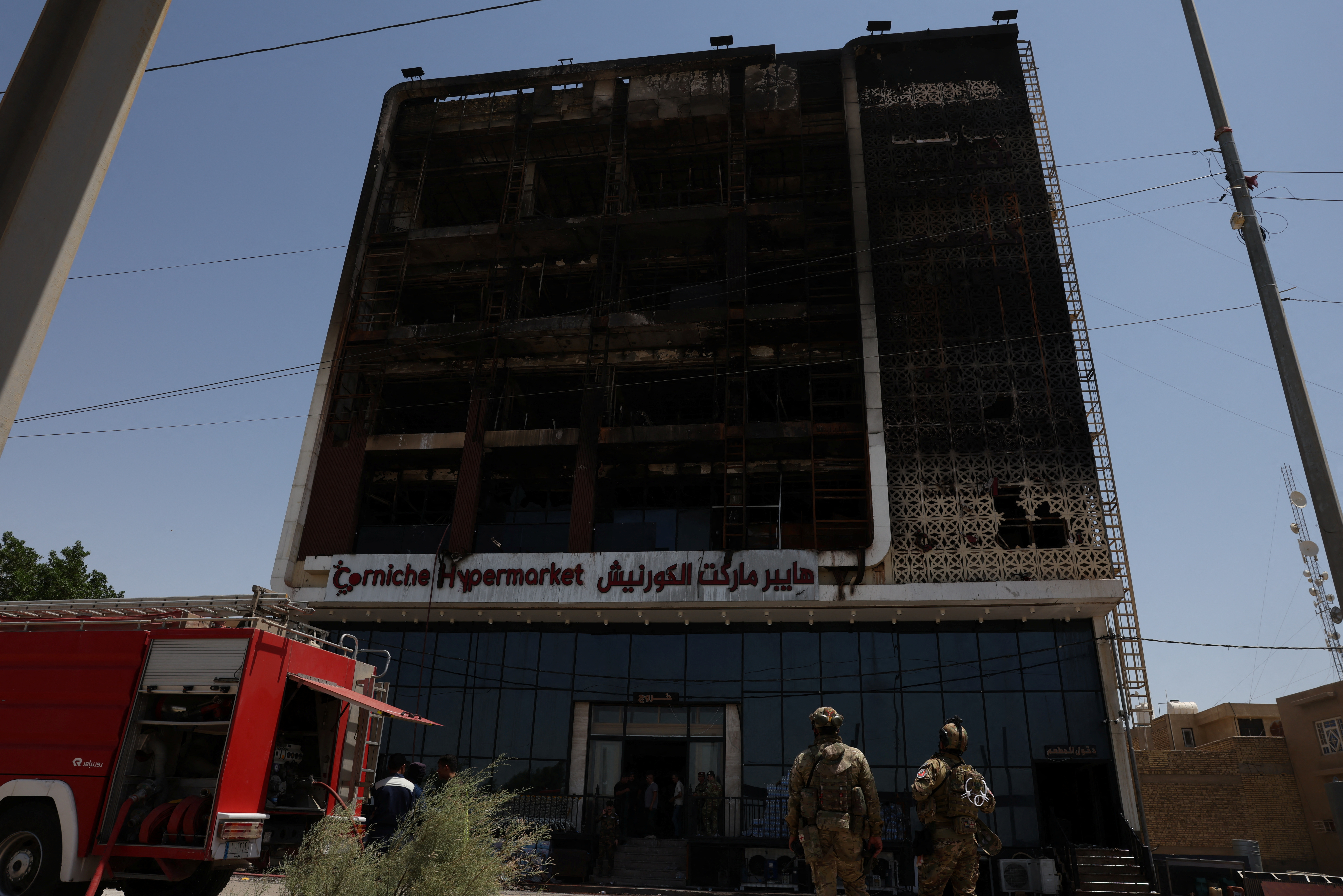 Overnight fire at a shopping center kills dozens of people, in al-Kut