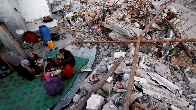 Palestinians break their fast amid the rubble of their destroyed home during Ramadan, in Rafah