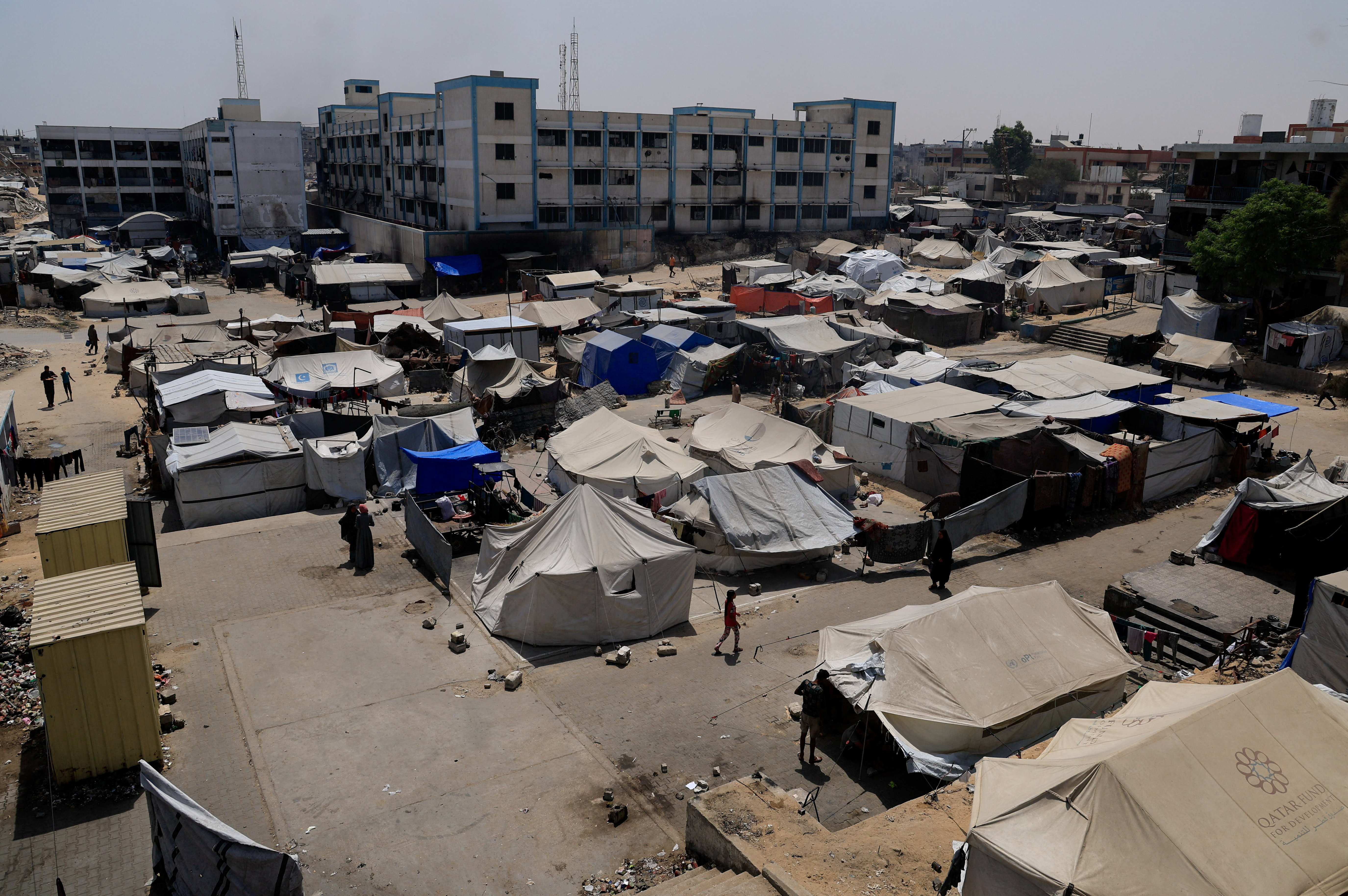Palestinians displaced by the Israeli military offensive shelter in an UNRWA school, in Khan Younis