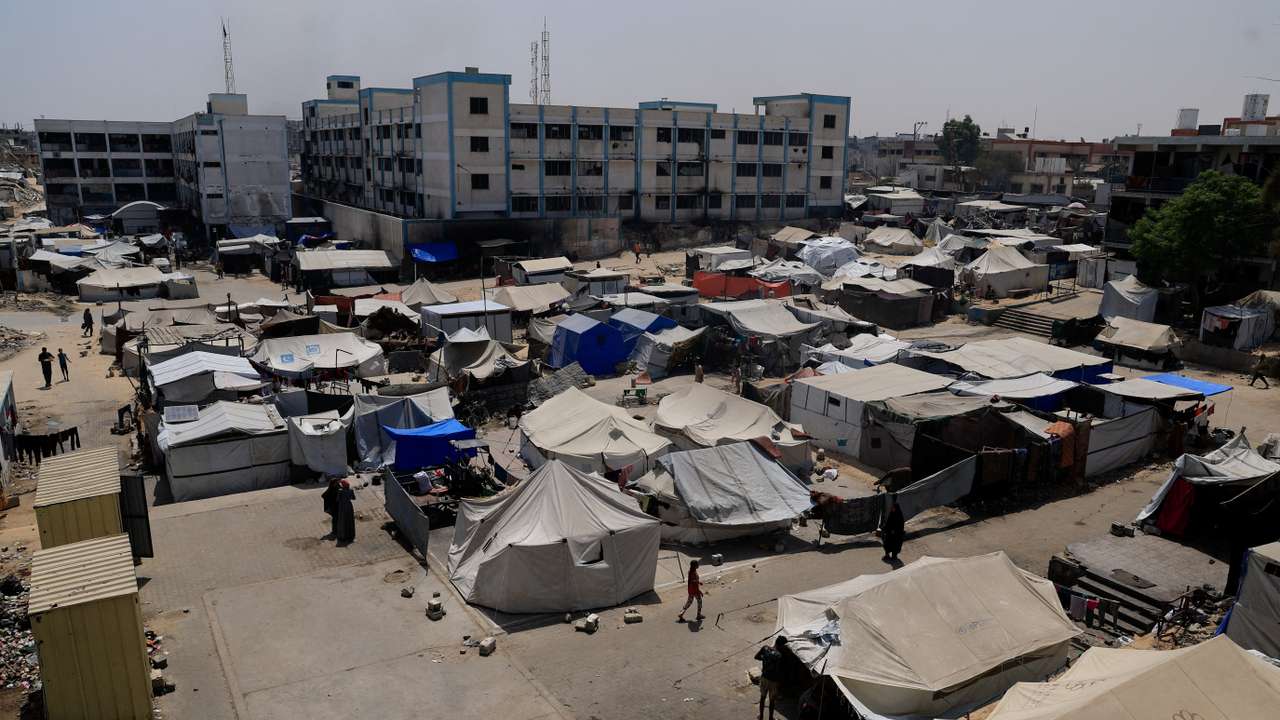 Palestinians displaced by the Israeli military offensive shelter in an UNRWA school, in Khan Younis