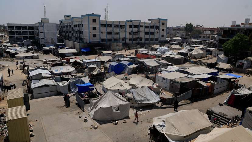 Palestinians displaced by the Israeli military offensive shelter in an UNRWA school, in Khan Younis