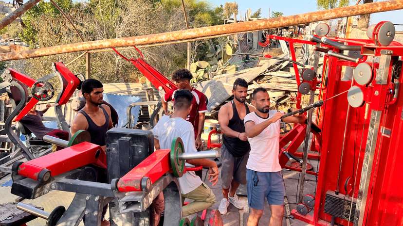 In gym salvaged from rubble, Gazans release anger on weight machines