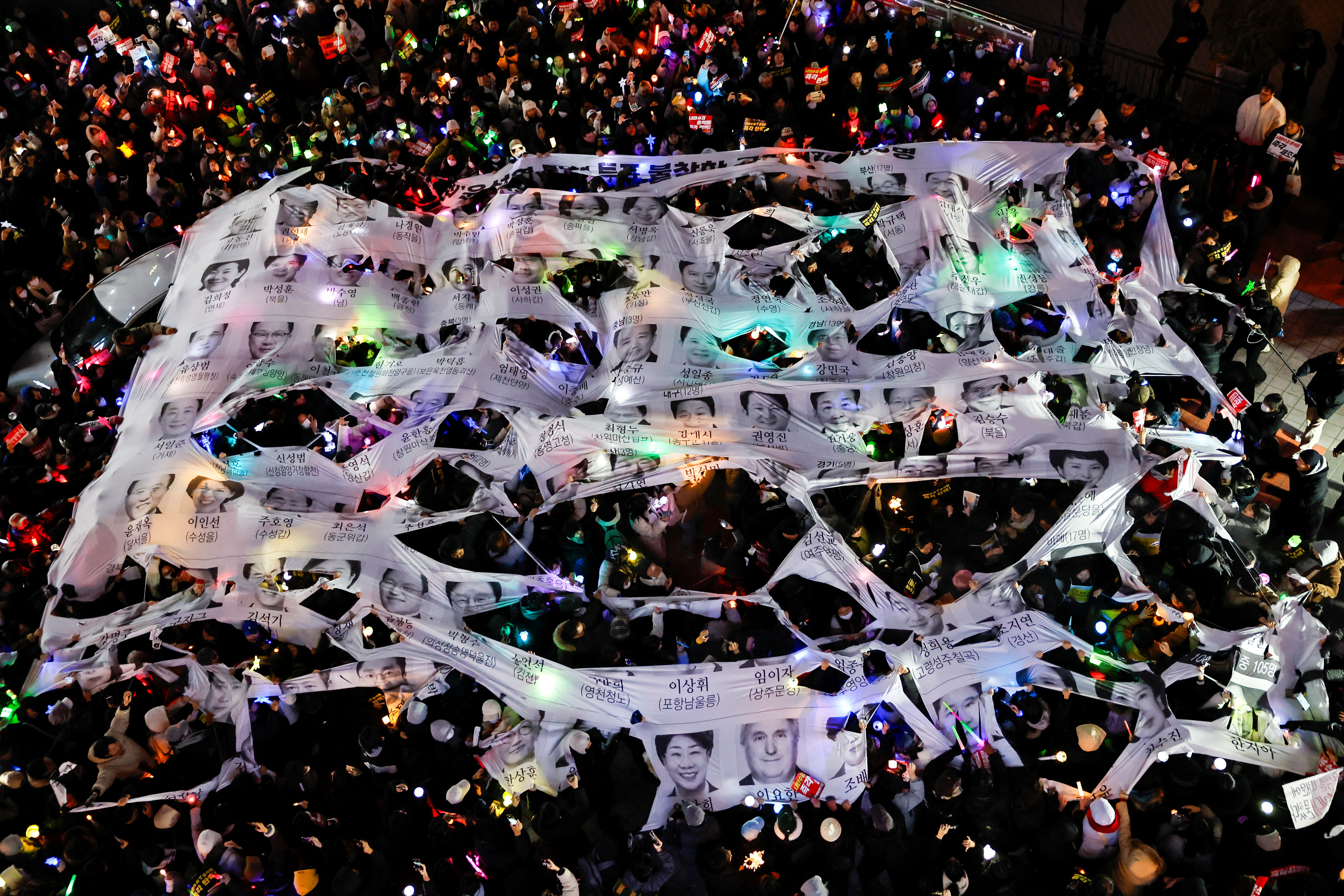 Protesters take part in a rally calling for the impeachment of South Korean President Yoon Suk Yeol, in front of the headquarters of the ruling People Power Party, in Seoul