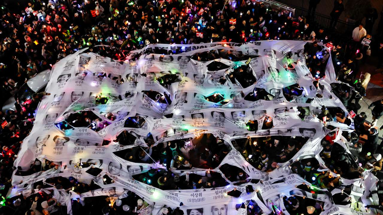 Protesters take part in a rally calling for the impeachment of South Korean President Yoon Suk Yeol, in front of the headquarters of the ruling People Power Party, in Seoul