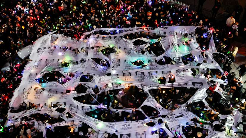 Protesters take part in a rally calling for the impeachment of South Korean President Yoon Suk Yeol, in front of the headquarters of the ruling People Power Party, in Seoul