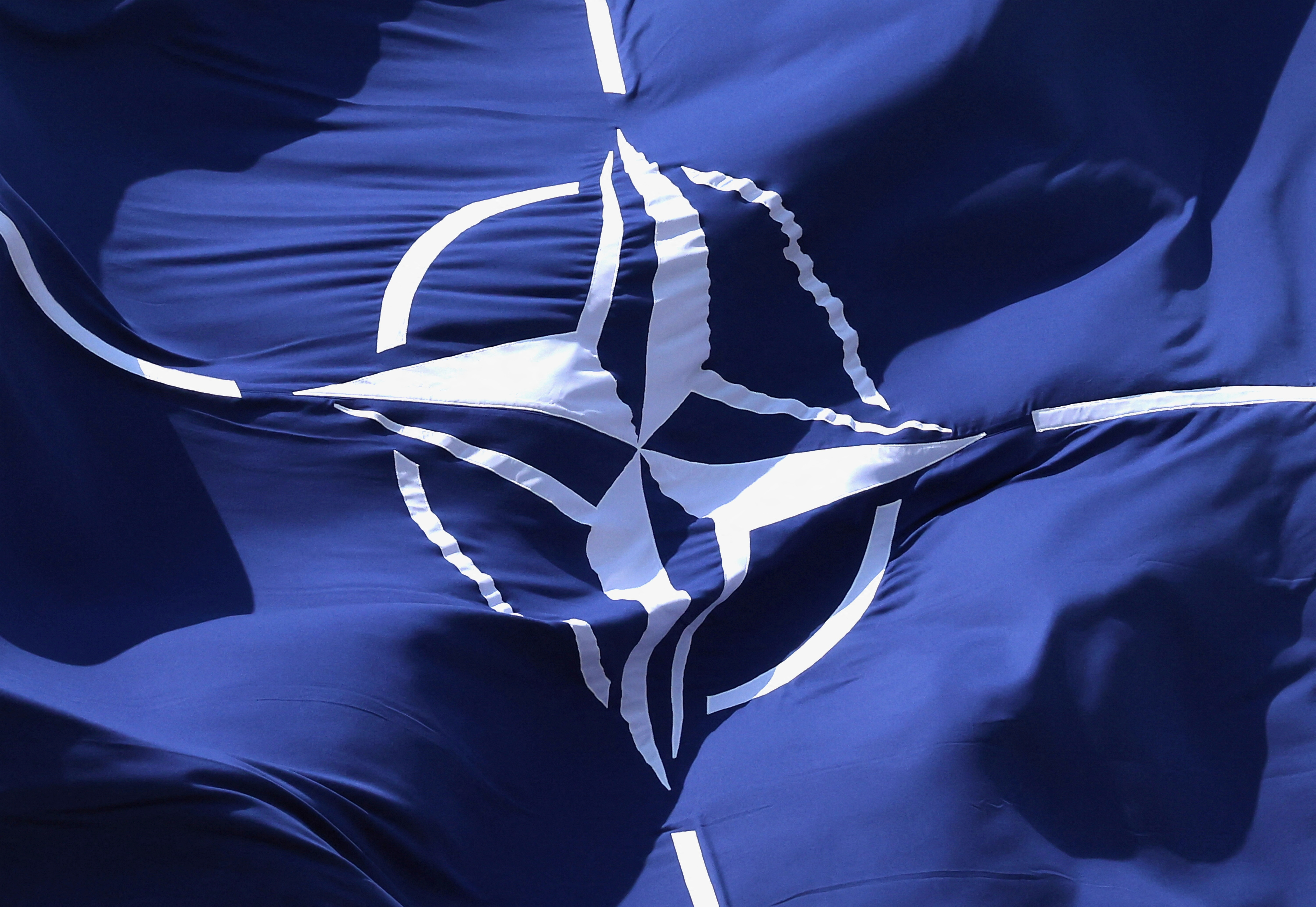 FILE PHOTO: A NATO flag flutters at NATO headquarters in Brussels