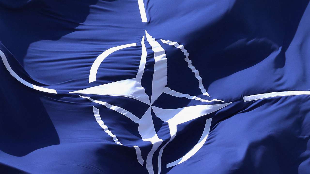 FILE PHOTO: A NATO flag flutters at NATO headquarters in Brussels