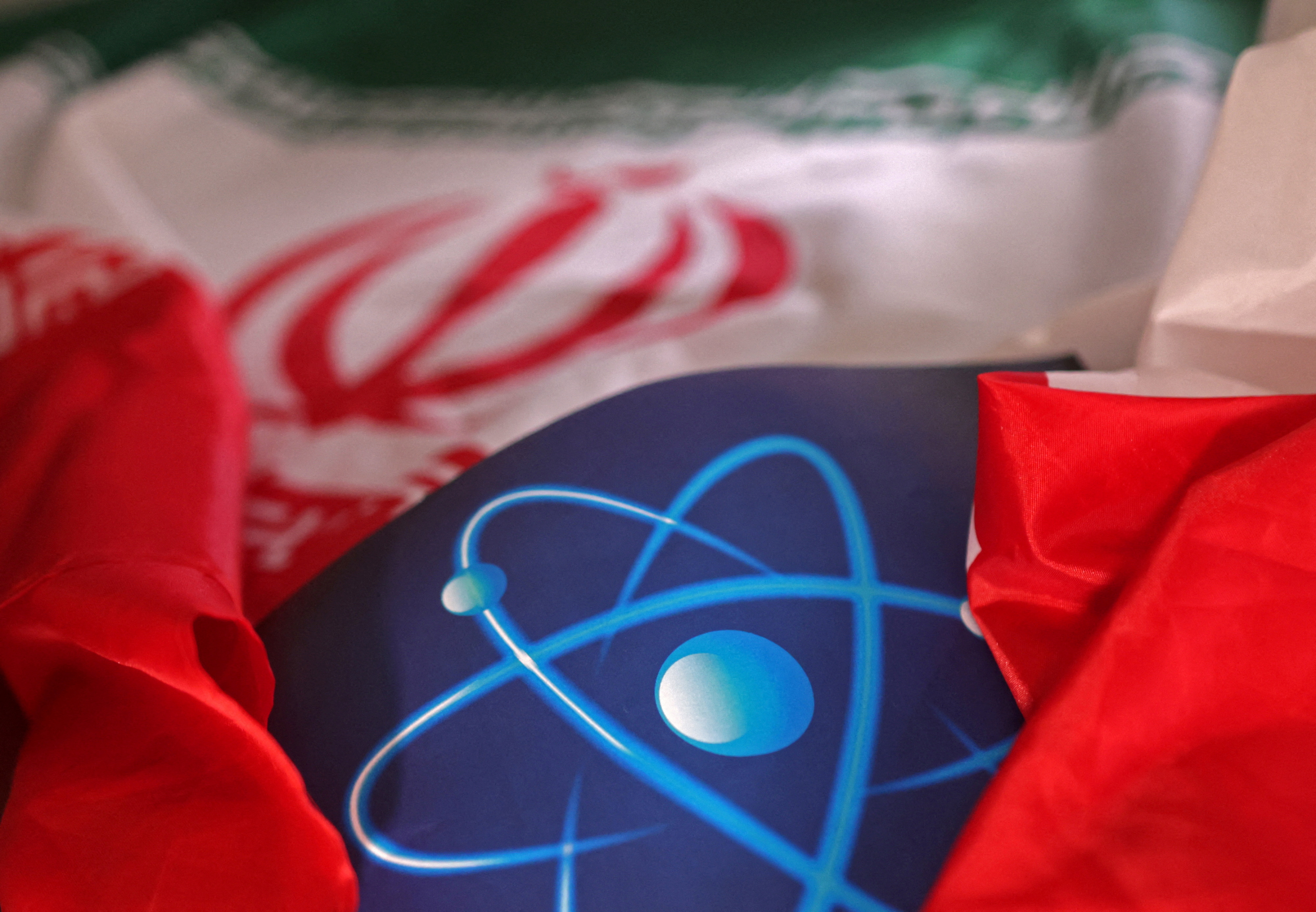 FILE PHOTO: Illustration shows atomic symbol and Iranian flag