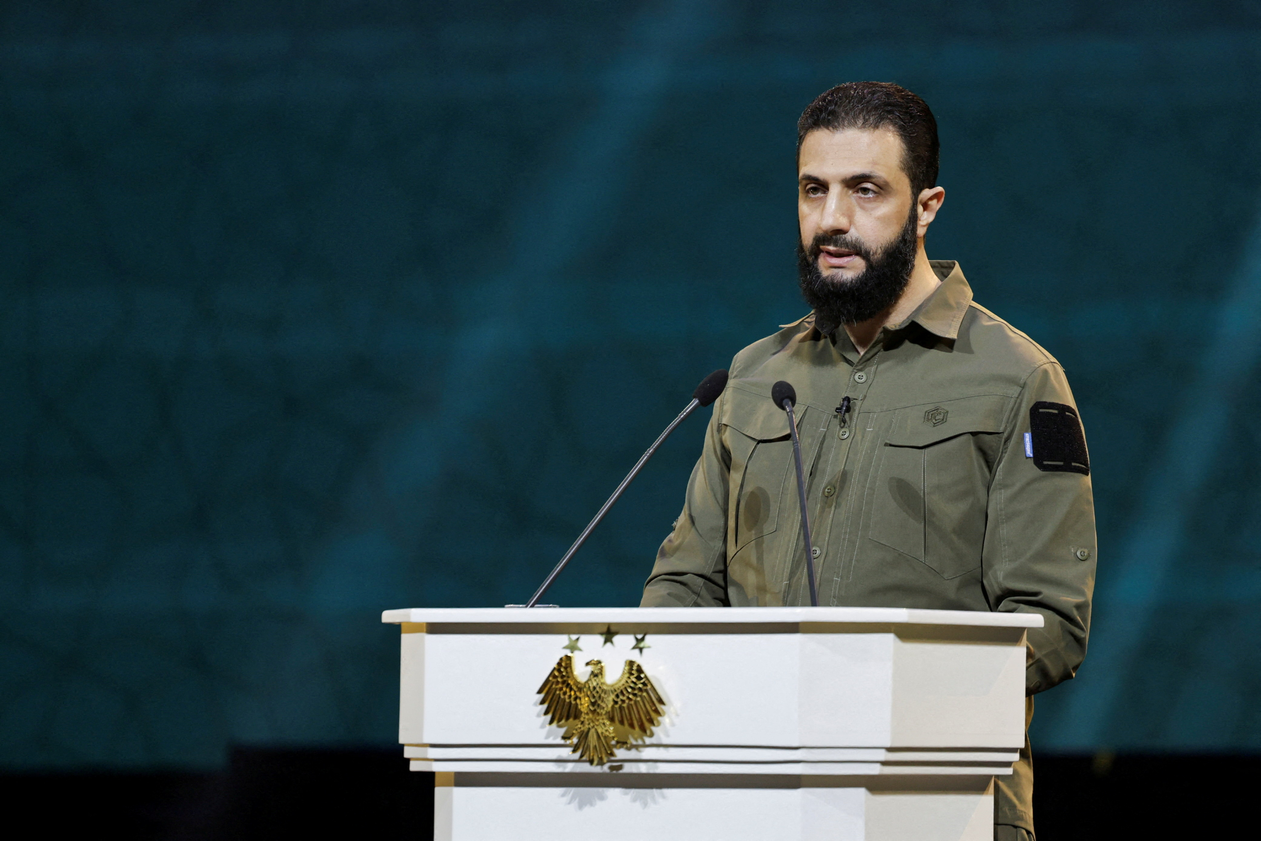 FILE PHOTO: Syria's President Ahmed al-Sharaa delivers a speech on the first anniversary of Bashar al-Assad's fall