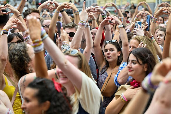 FILE PHOTO: Fans gather after the government confirmed a planned attack at the venue of three Taylor Swift concerts, in Vienna