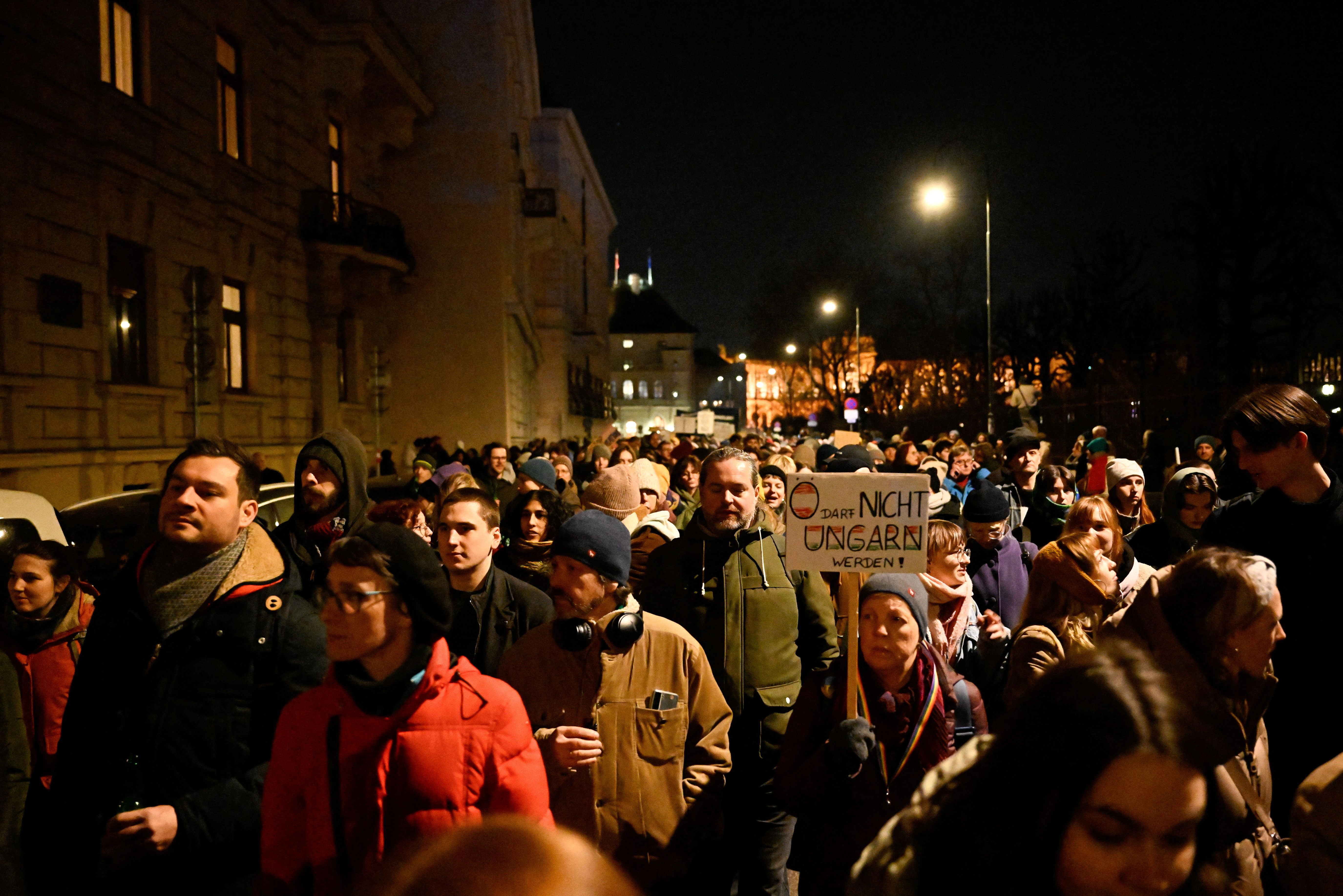 People take part in a protest against the participation of far-right party FPO in the process of forming a coalition government in Vienna