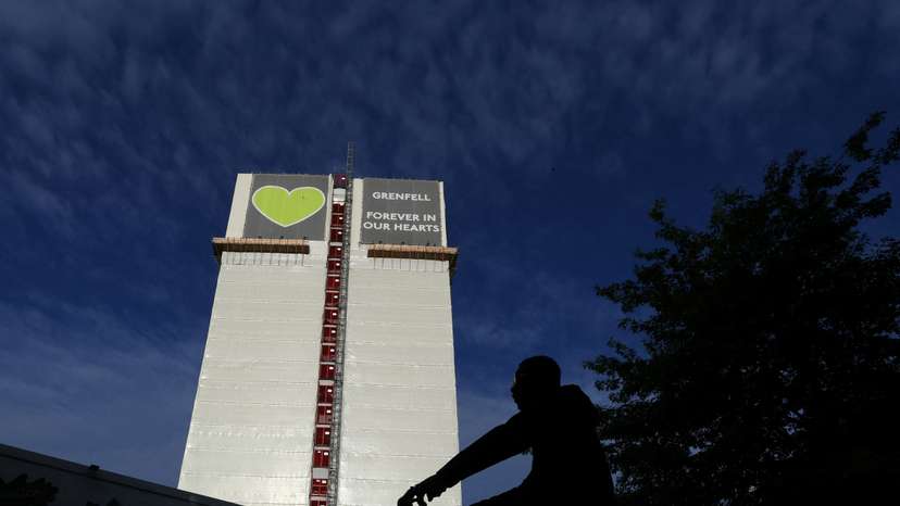 Covered remains of Grenfell Tower seen, as report from UK public inquiry into the deadly 2017 Grenfell fire published, in London