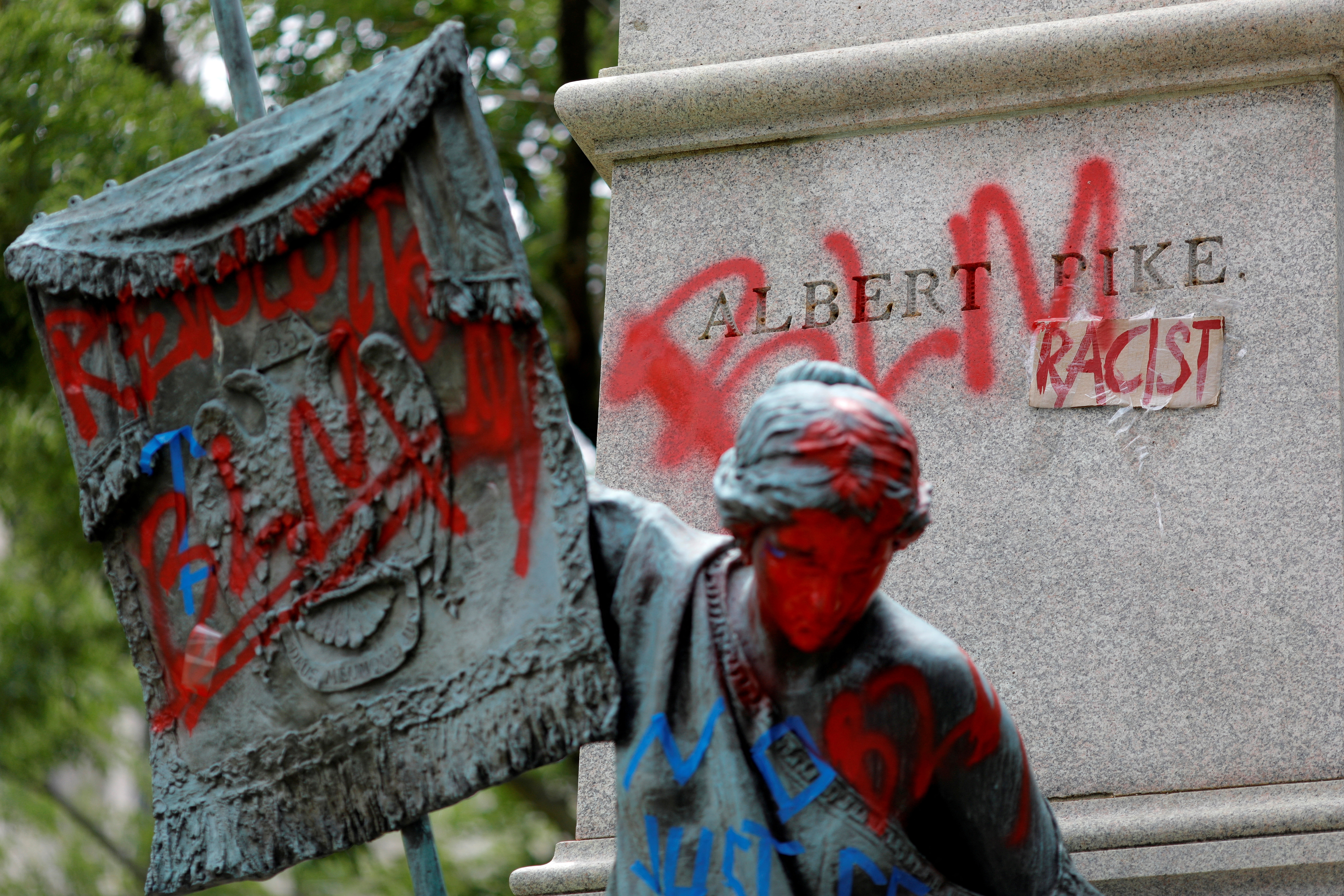 FILE PHOTO: Messages of protest remain after protesters toppled the statue of Albert Pike in Washington