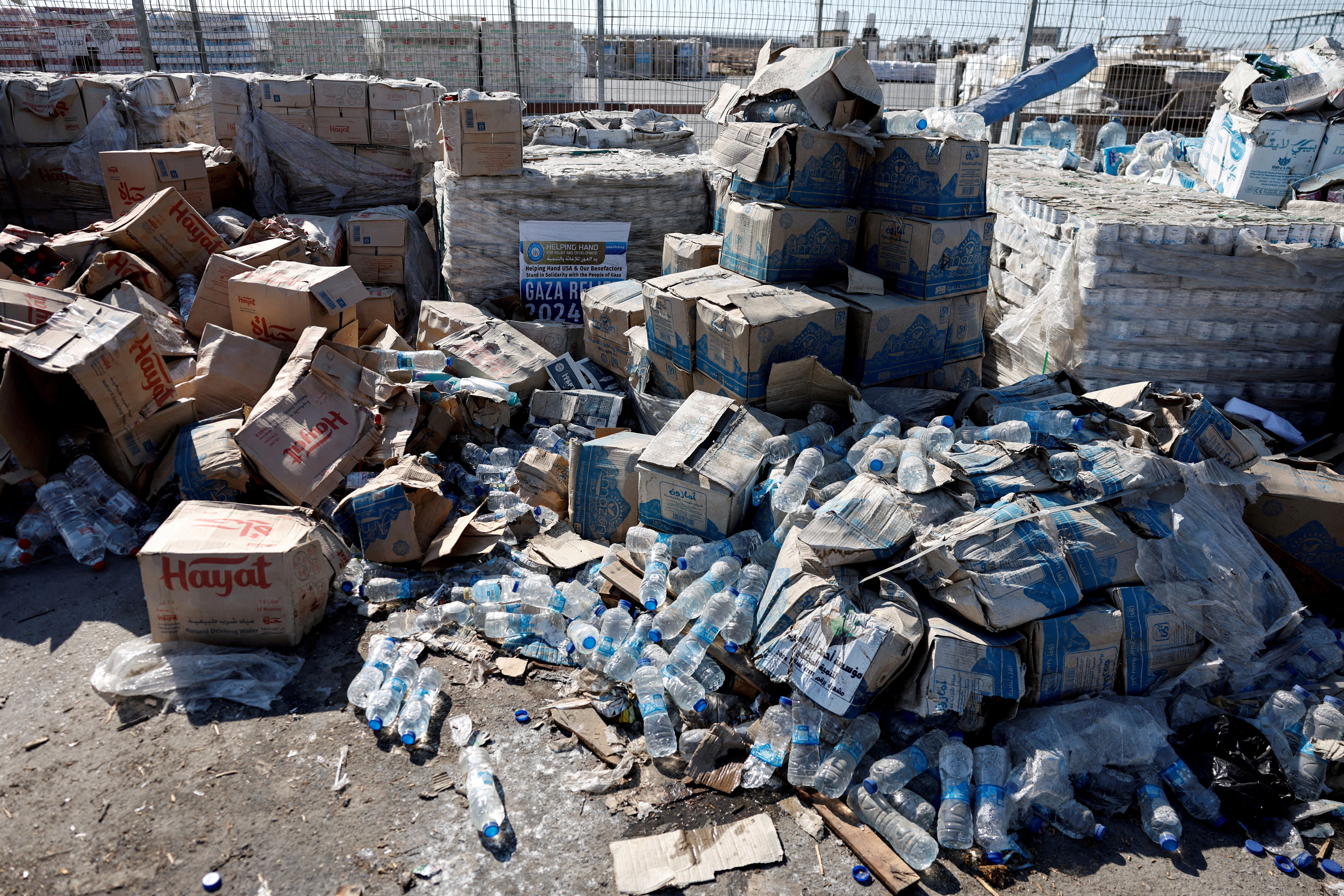 FILE PHOTO: Humanitarian aid waits to be transferred into Gaza from Israel, at the Gaza part of the Kerem Shalom crossing in the Gaza Strip
