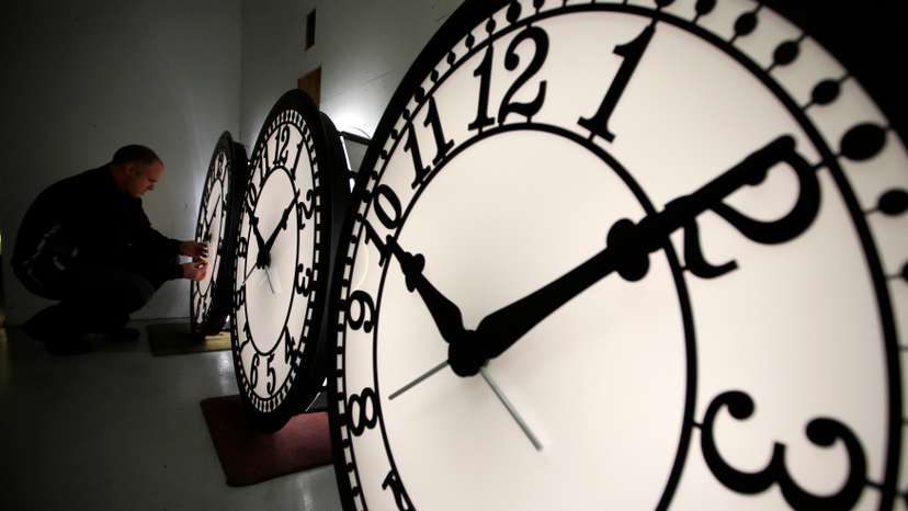 Peter Shugrue checks one of four custom, flush mounted clocks, destined for installation in Kansas City, Missouri, at the Electric Time Company factory in Medfield