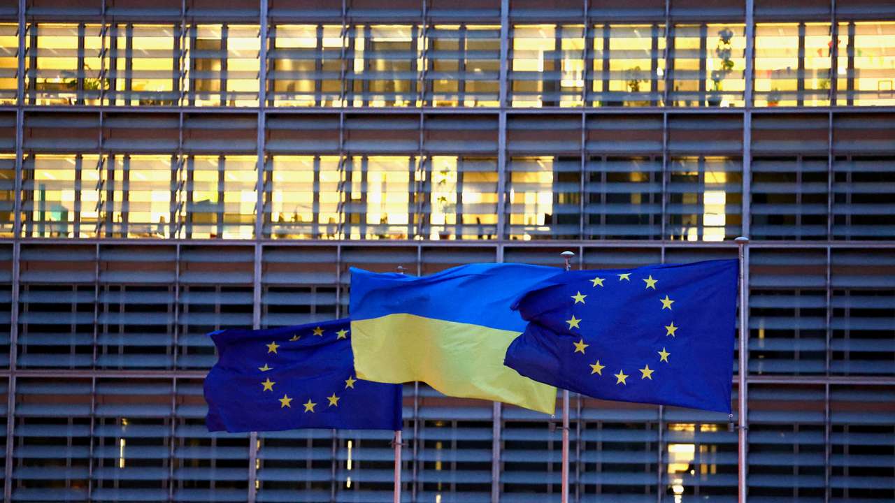 European Union flags and a Ukrainian flag flutter outside the EU Commission headquarters in Brussels