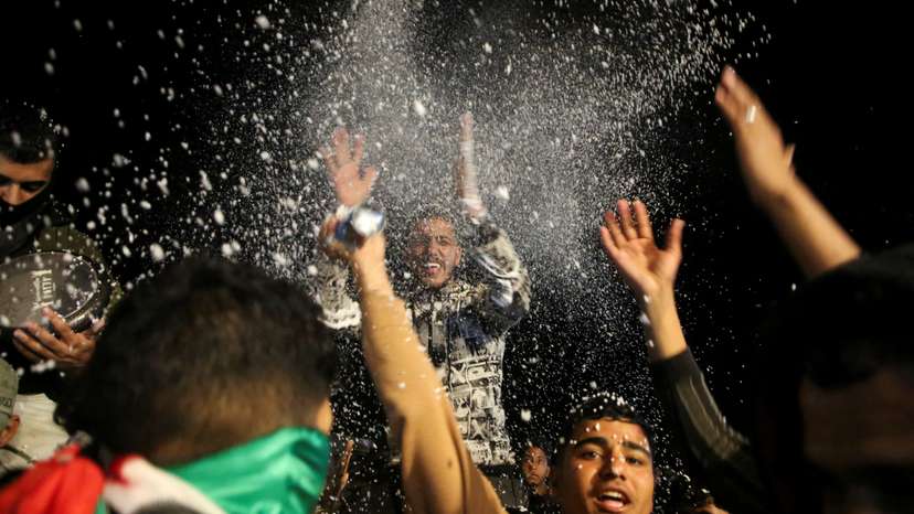 Palestinians react to news on a ceasefire deal with Israel, in Khan Younis in the southern Gaza Strip