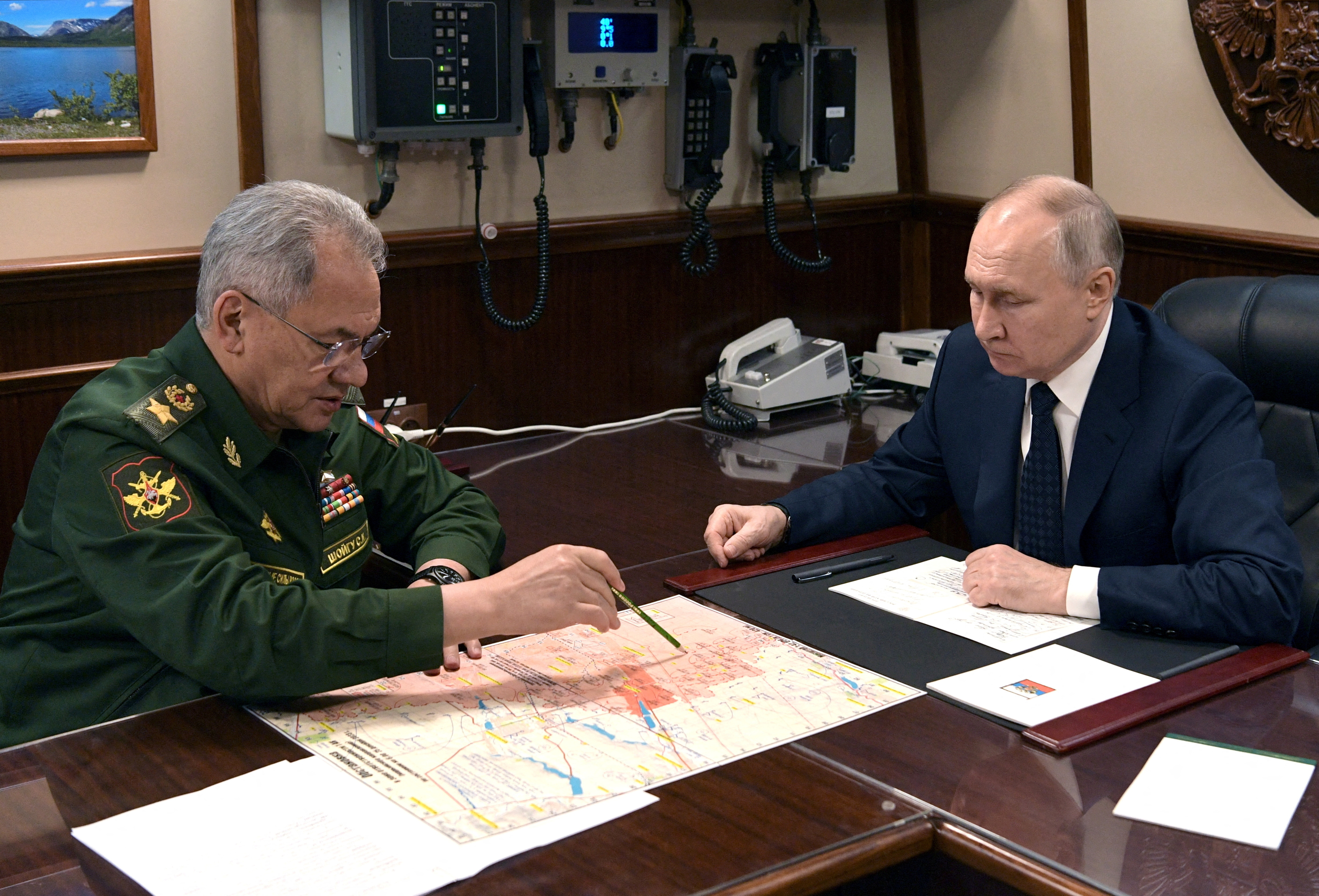 FILE PHOTO: Russia's President Putin and Defence Minister Shoigu meet in St Petersburg