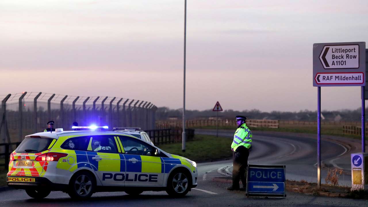 British police stand guard at the entrance to the US Air Force base at RAF Mildenhall, Suffolk