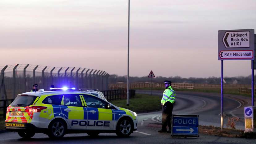 British police stand guard at the entrance to the US Air Force base at RAF Mildenhall, Suffolk