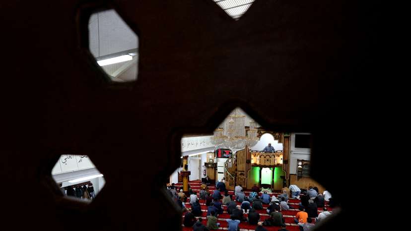 FILE PHOTO: Muslims attend Friday prayers in Berlin