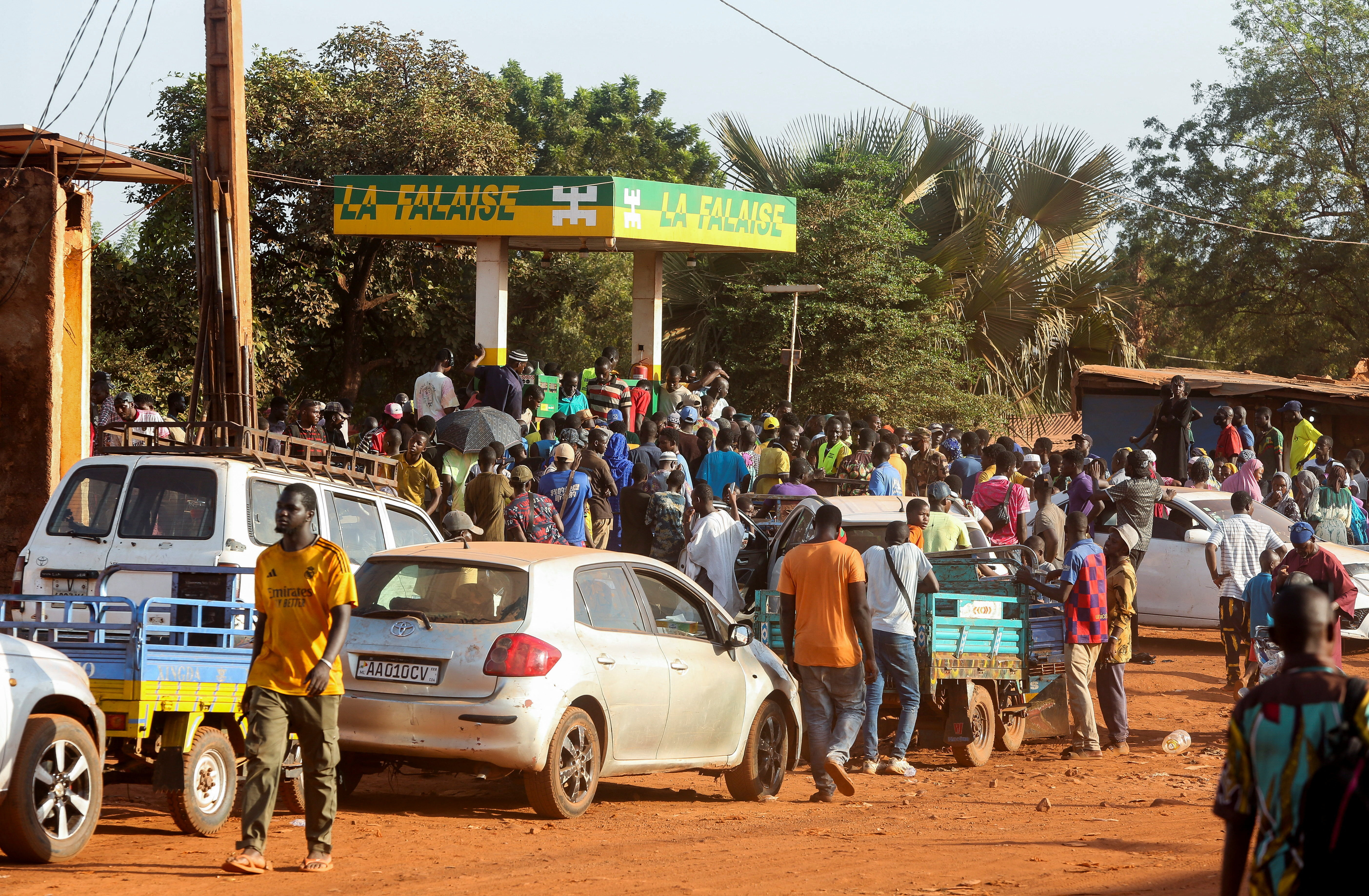 People gather at a petrol station in Bamako, Mali