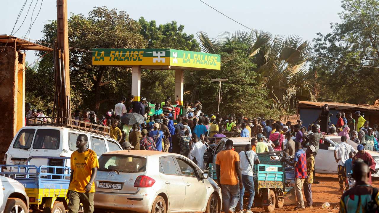 People gather at a petrol station in Bamako, Mali