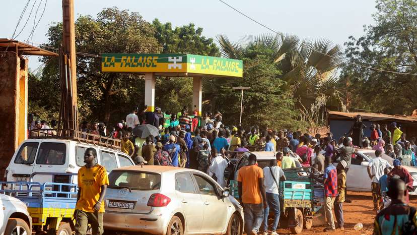 People gather at a petrol station in Bamako, Mali