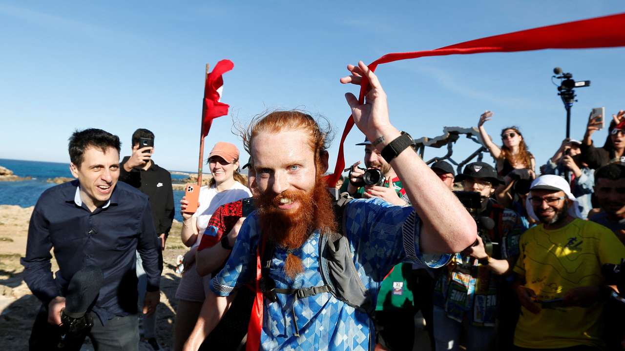 Britain's Russ Cook becomes the first person to run the entire length of Africa