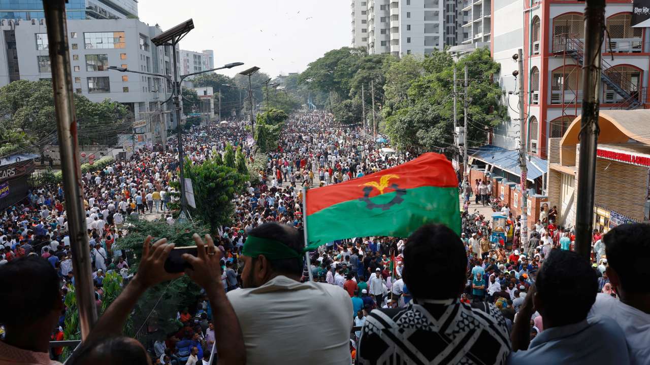 Supporters of Bangladesh Nationalist Party (BNP) wave party flag during a rally at Naya Paltan area in Dhaka