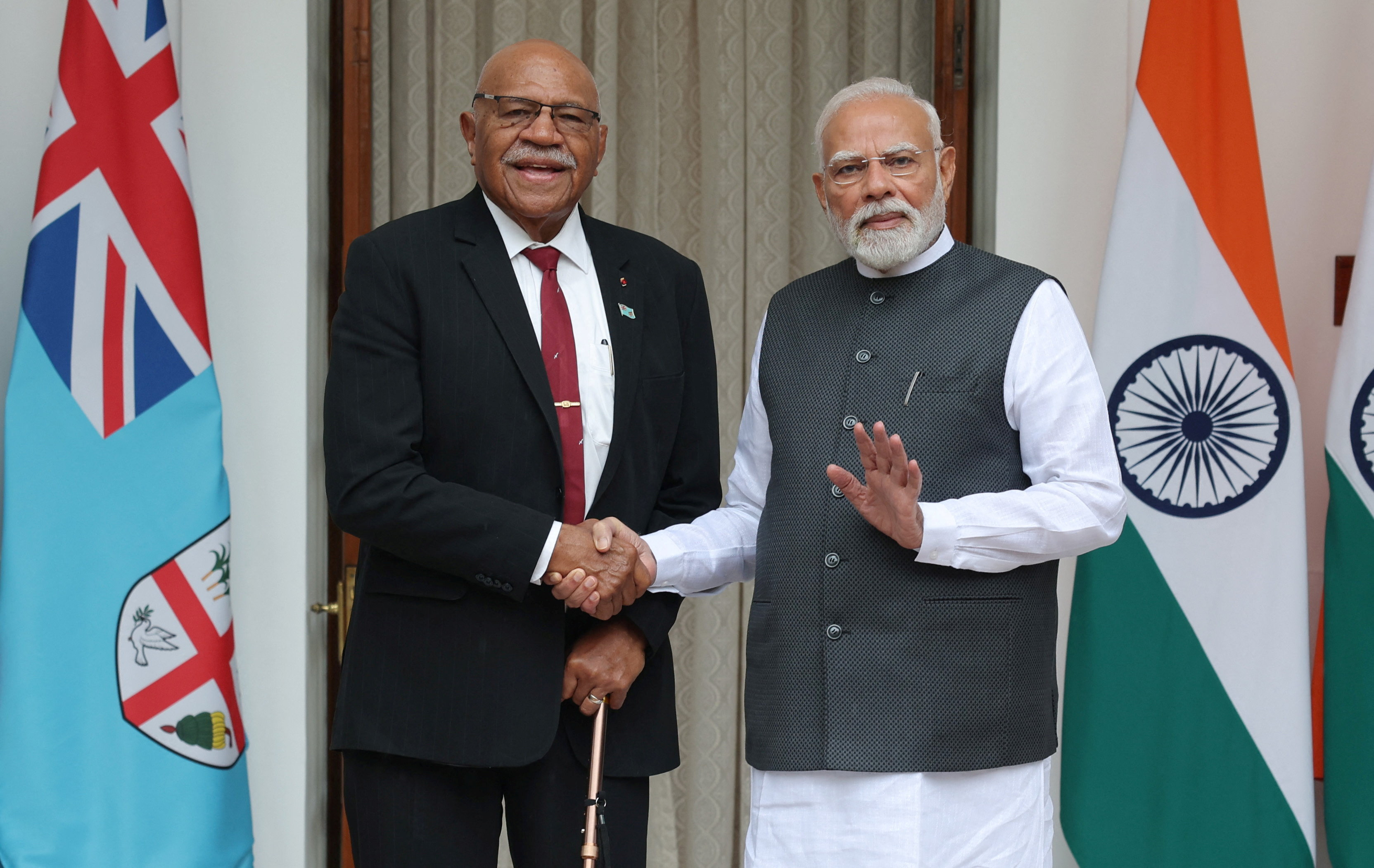 Fiji's Prime Minister Sitiveni Rabuka meets his Indian counterpart Narendra Modi at the Hyderabad House in New Delhi