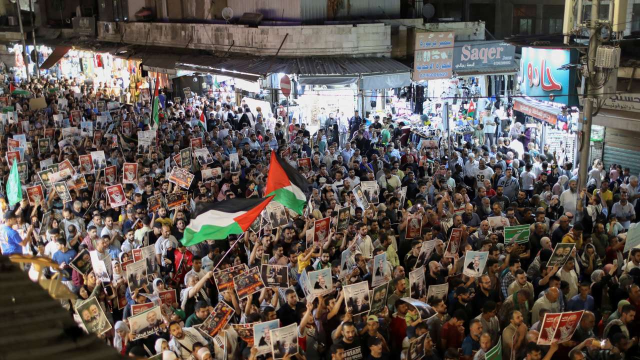 Demonstrators take part in a symbolic funeral for Hamas leader Ismail Haniyeh who was killed, in Amman