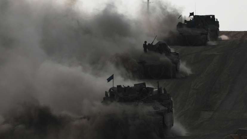 Israeli armoured personnel carriers (APC) operate, amid the ongoing conflict between Israel and the Palestinian Islamist group Hamas, near Israel's border with Gaza in southern Israel