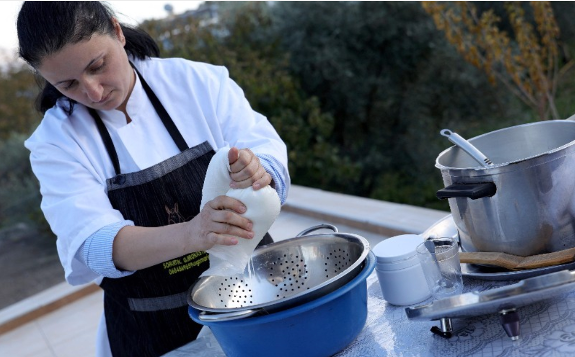 Xhiko Basha, makes donkey cheese at her family house in Lazarat village, near Gjirokaster, on November 28, 2024.