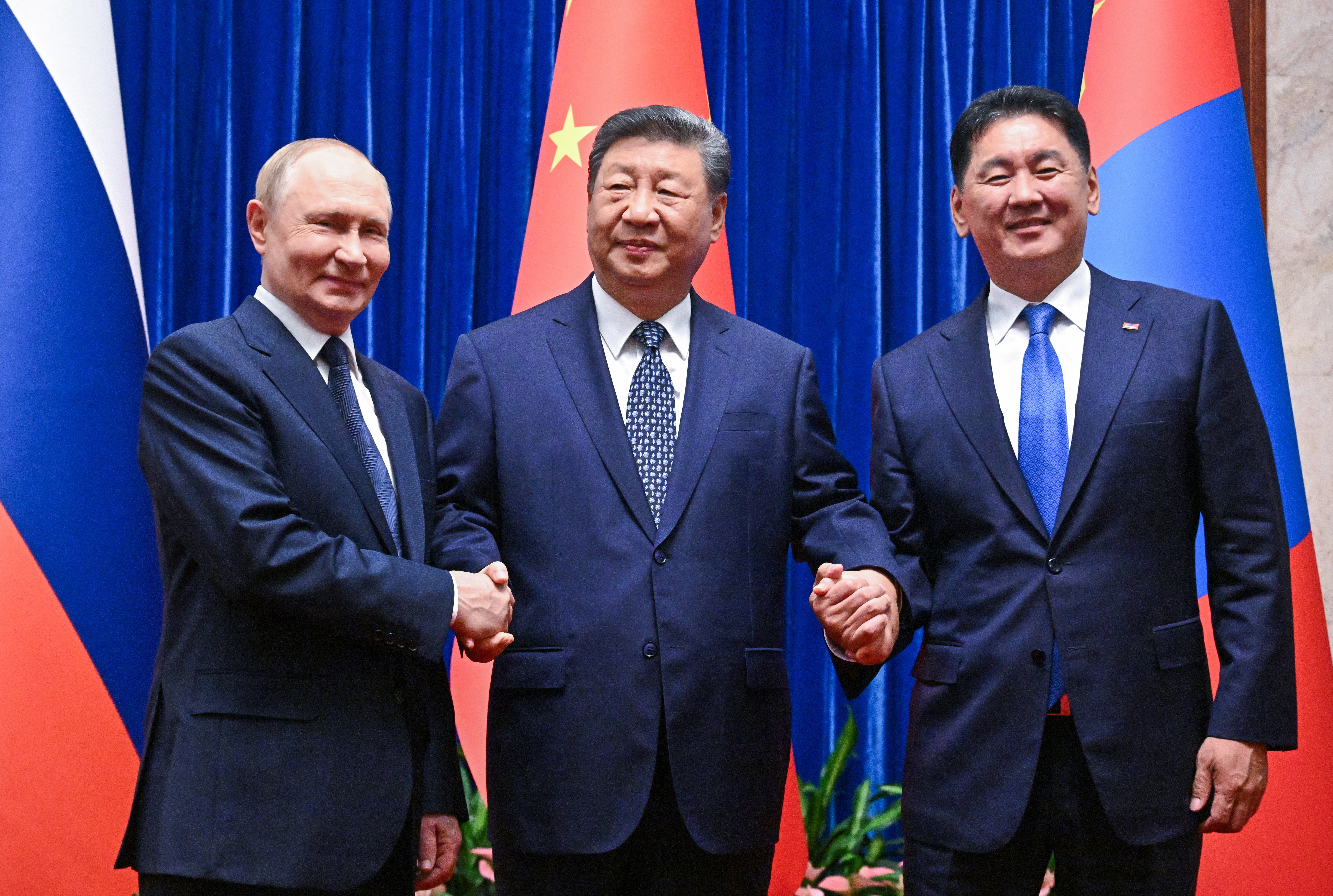 Russian President Vladimir Putin meets with Chinese President Xi Jinping and Mongolian President Ukhnaagiin Khurelsukh in Beijing