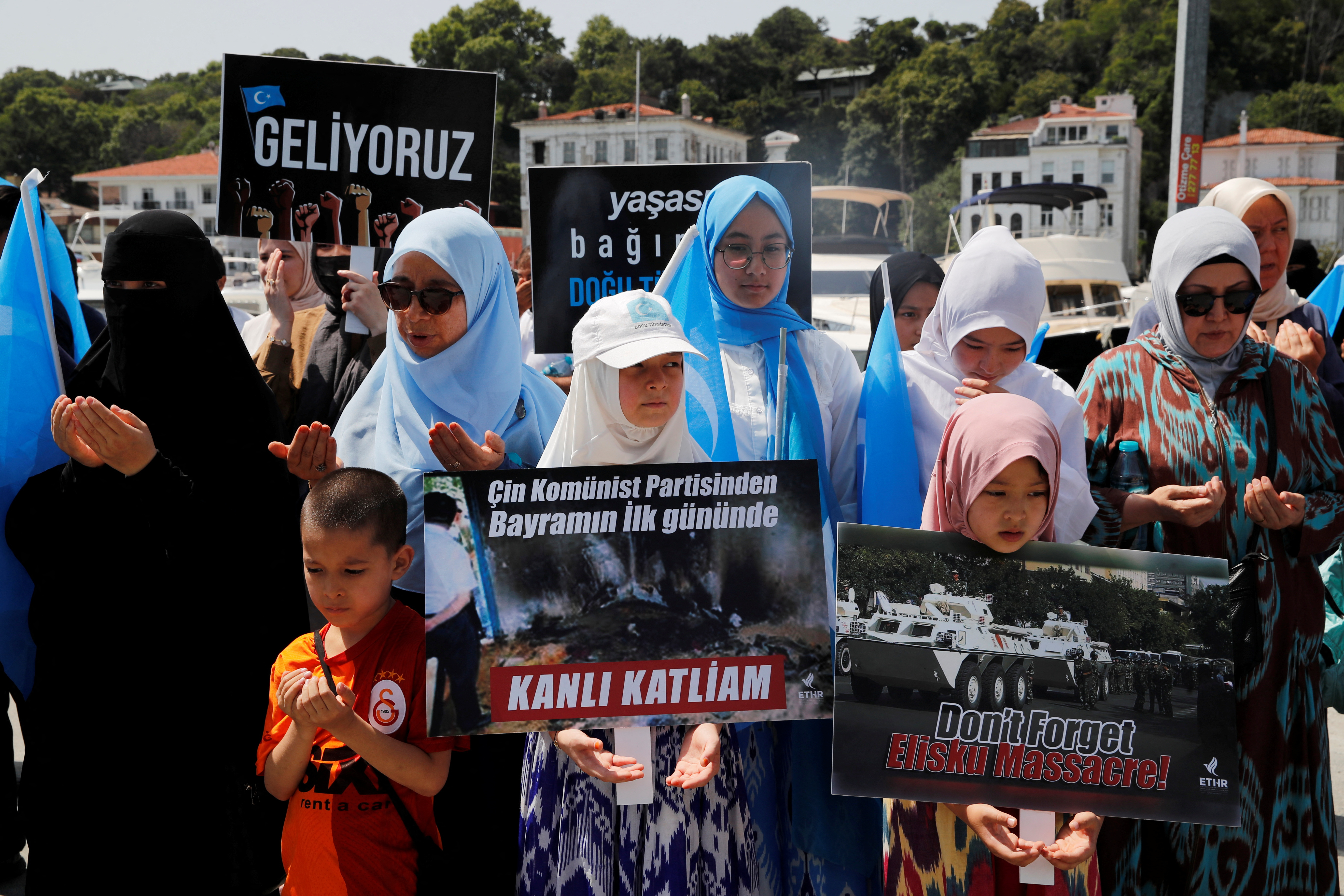 Ethnic Uyghur demonstrators take part in a protest against the visit of Chinese Foreign Minister Wang Yi to the Turkish capital in Istanbul