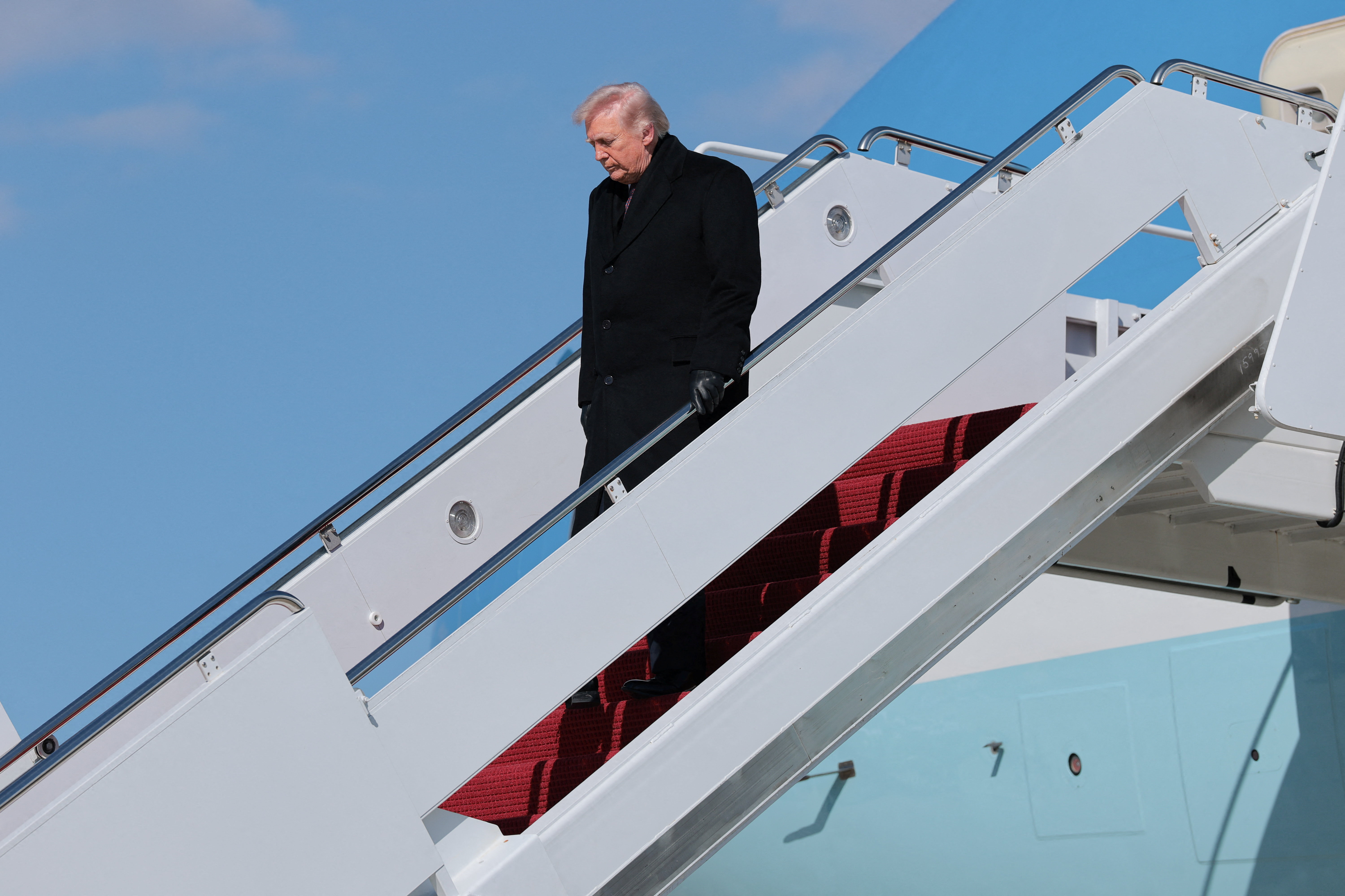 U.S. President Trump disembarks Air Force One as he arrives at Joint Base Andrews, Maryland