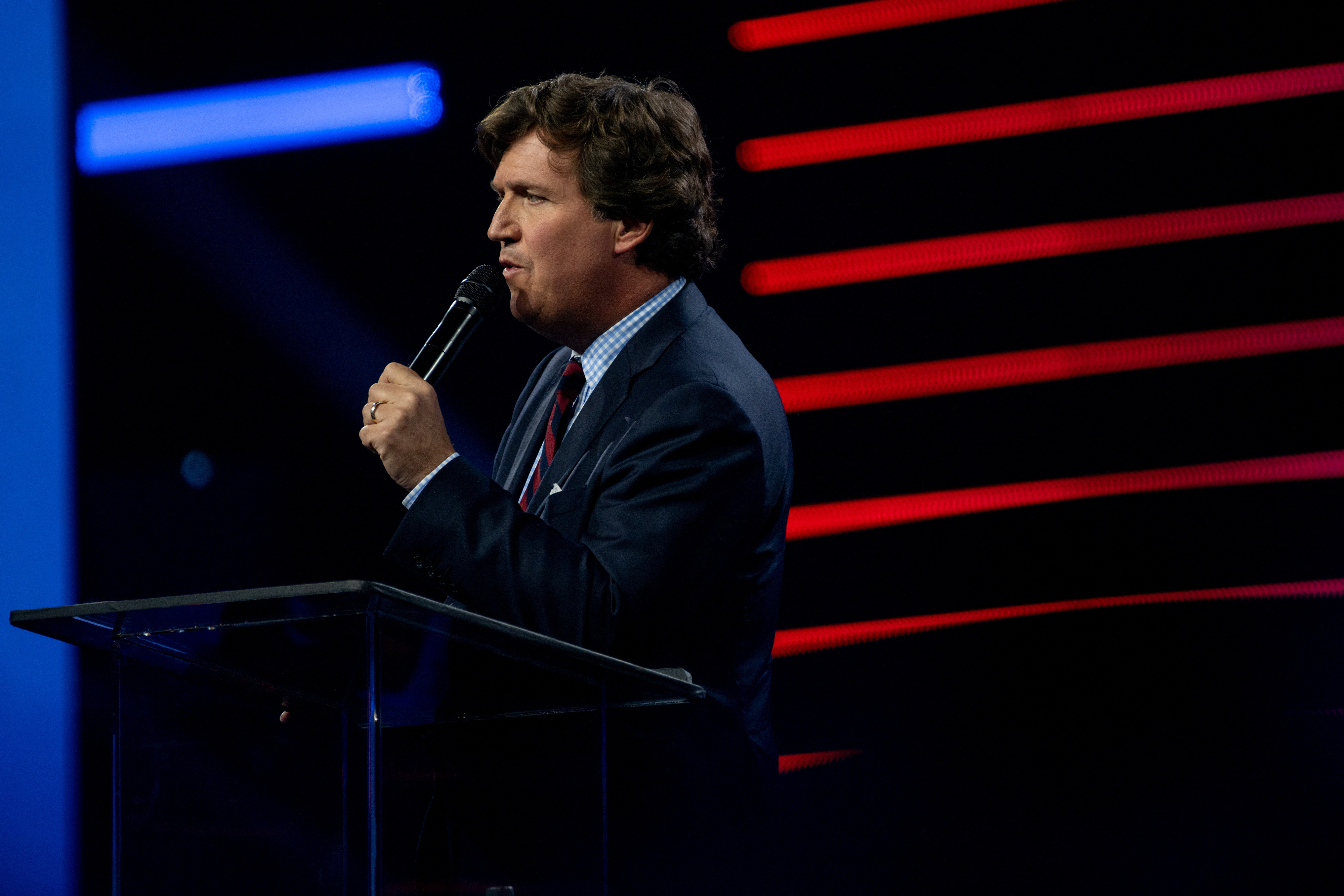 Tucker Carlson speaks as conservative leaders and personalities attend Turning Point USA's AmericaFest 2023 in Phoenix