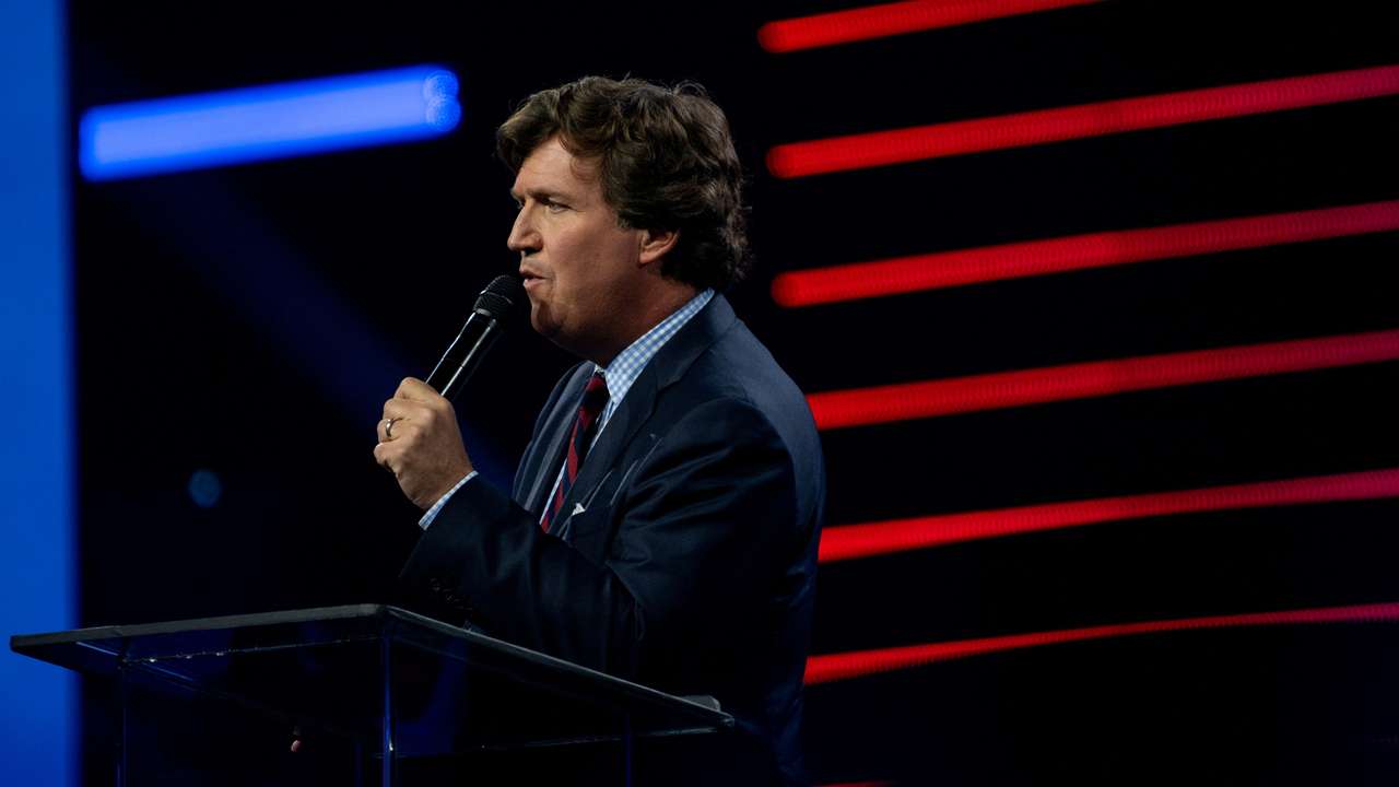Tucker Carlson speaks as conservative leaders and personalities attend Turning Point USA's AmericaFest 2023 in Phoenix