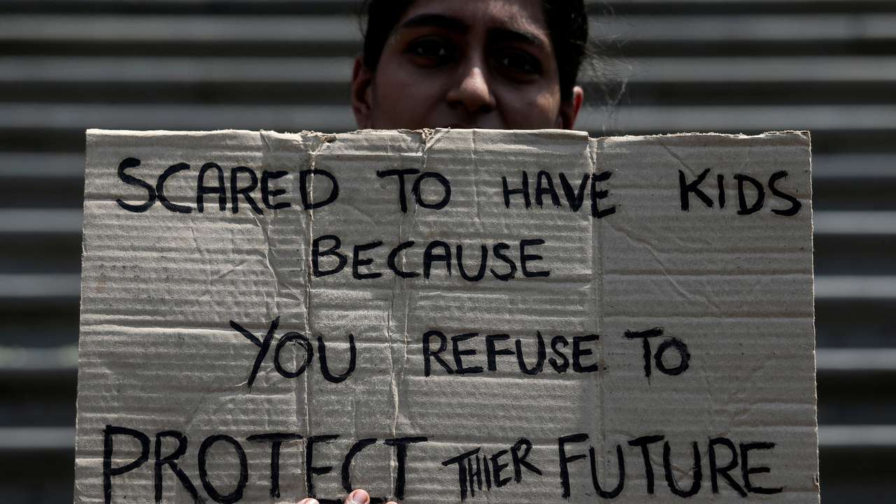 FILE PHOTO: FILE PHOTO: A student takes part in a global protest against climate change in Mumbai