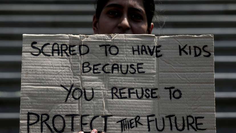 FILE PHOTO: FILE PHOTO: A student takes part in a global protest against climate change in Mumbai
