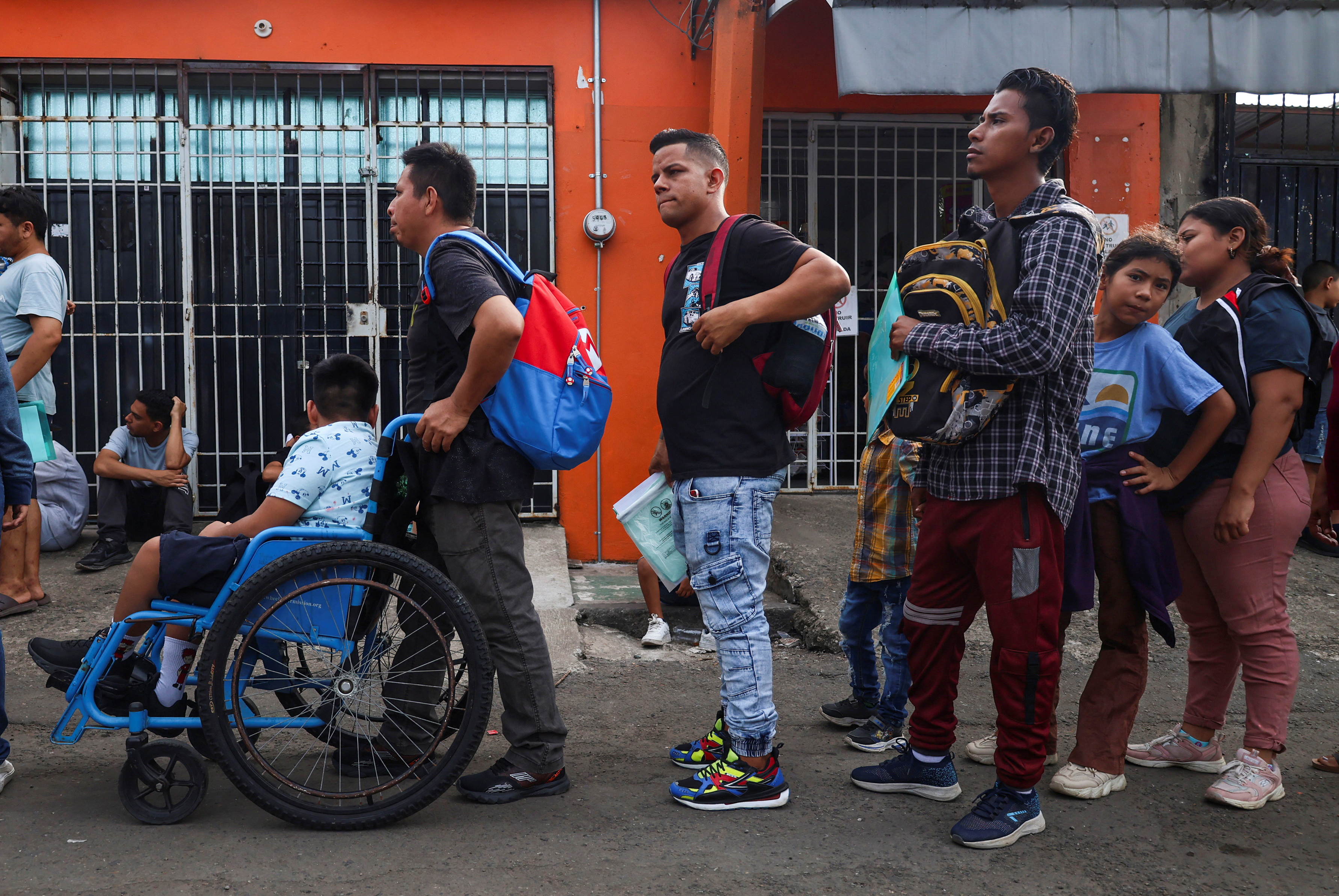 Migrants apply for permits at the Mexico's National Migration Institute office, in Tapachula