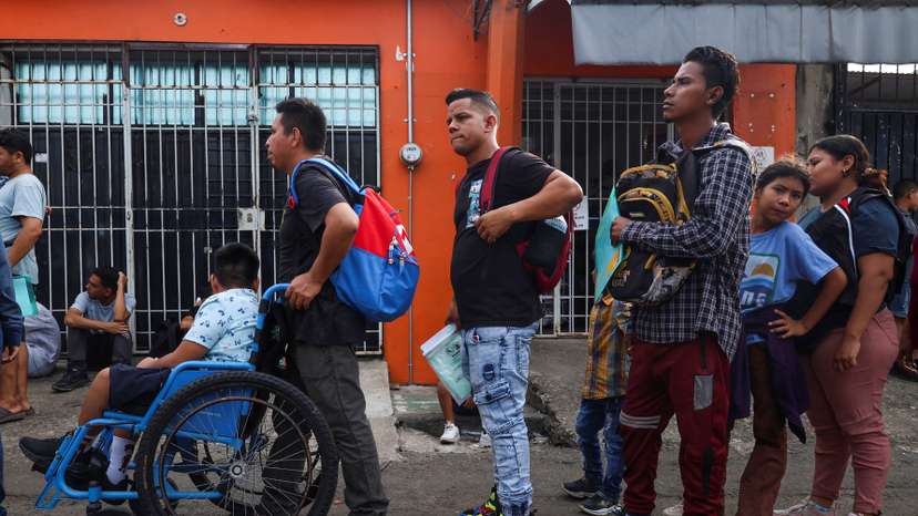Migrants apply for permits at the Mexico's National Migration Institute office, in Tapachula