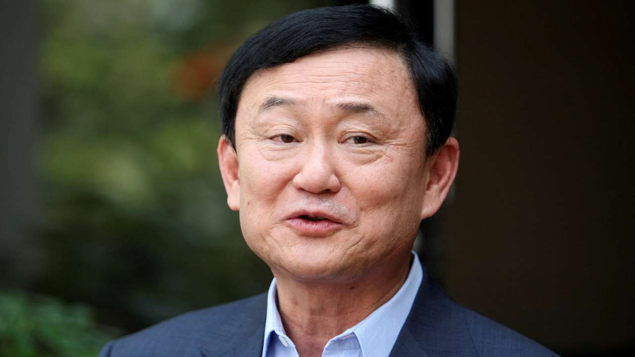FILE PHOTO: Thailand's former premier Thaksin Shinawatra speaks to journalists outside his home in Dubai