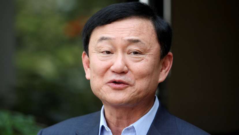 FILE PHOTO: Thailand's former premier Thaksin Shinawatra speaks to journalists outside his home in Dubai